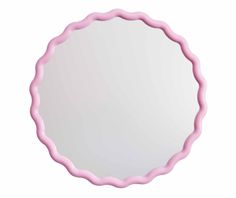 a round mirror with pink trim around it