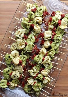 several skewered food items on a clear plate