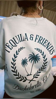 the back of a woman's white shirt that says, tequila & friends bachelor club