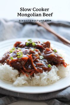 a white plate topped with beef and rice