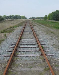 an old train track with no cars on it