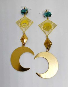 Brass crescent moon earrings with crystal cut glass beads. Approximately 4 1/4" inches in length. Ear hooks are .925 sterling silver. Elegant Metal Earrings With Sun And Moon Design, Pierced Metal Half Moon Jewelry, Pierced Half Moon Metal Jewelry, Half Moon Pierced Metal Jewelry, Elegant Sun And Moon Design Metal Earrings, Metal Dangle Earrings With Moon Phase, Nickel-free Celestial Crystal Earrings, Metal Crescent Moon Phase Earrings, Crescent-shaped Metal Ear Wire Jewelry