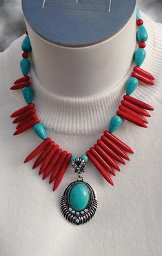 Red Spikes with Turquoise, pewter and red beads sets a good contrast for this necklace. Highlighted with a silver pendant and a turquoise center stone. The pendant is also accented with 12 rhinestones to add a special glitter to this glamorous necklace. The necklace will be worn close to the neck at 15 1/5" in length. Also has a 1 1/2" plated chain extension. Red Southwestern Turquoise Necklace For Gift, Pioneer Kitchen, Red Beads, Red Turquoise, Red Bead, Silver Pendant, Beaded Necklace, Birthday Gifts, Accessory Gift