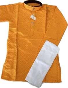 Fabric: Art Silk Top: Fully stitched Pant: Fully stitched Size: 2 Years Dress your little prince in style with this golden orange kurta designed specifically for 2-year-old boys. The set comes with a pair of white pants to complete the traditional Indian look. Made of high-quality art silk material, this kurta is not only comfortable but also durable, perfect for the active lifestyle of young children. Whether it's for a special occasion or just a casual day out, this kurta is the perfect choice for dressing up your little one. Get your hands on this stylish kurta set and make your child stand out in the crowd. *Dry clean only *Note: The fabric colors you see on our website may vary slightly depending on the color variations of each photograph, lighting, specific monitor, and settings. --- Stylish Kurta, Boys Kurta, Indian Look, Silk Kurta, Little Prince, Kurta Designs, Silk Material, Clothing Sets, Kurta Set