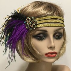 Mardi Gras Headpiece, Purple Green Gold feather Headband, Mardi Gras Headband, New Orleans Parade, Festival Headpiece, Jazz Age Very beautiful and festive! Made with three rows of gold woven metallic elastic. Accompanied with a very generous amount of Ostrich feathers in Mardi Gras colors. I embellished this headpiece with a Vintage inspired iridescent bronze rhinestone brooch.  PLEASE NOTE: The headband measures 21" un-stretched. If you need me to make a smaller one for you please advise. I have designed and created each piece from my smoke-free studio. All pieces are securely wrapped and boxed to prevent damage/breakage. Ready to ship.  Feel free to convo me if you have any questions. Thank you very much for visiting my shop. Have a blooming day! Luxury Headpieces For Mardi Gras Carnival, Mardi Gras Headpiece, Mardi Gras Headband, Festival Headpiece, Head Dress, Feather Headband, Gold Feathers, Jazz Age, Ostrich Feathers