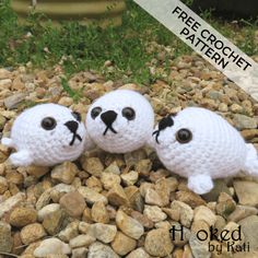 two crocheted sheeps are sitting on some rocks and gravel with the words free crochet pattern above them