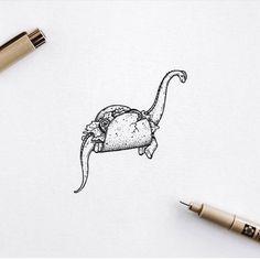 a drawing of an animal with a hat on it's head is shown next to a pen