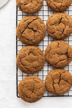 freshly baked ginger cookies cooling on a wire rack