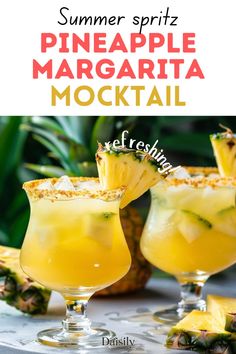 two glasses filled with pineapple margarita cocktail