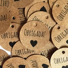 many wooden tags with names and hearts on them