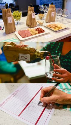 a person pouring wine into a glass at a table with food and drinks on it