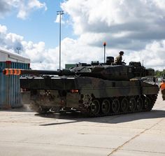 an army tank sitting on top of a tarmac