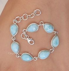 Dominican Larimar Bracelet / 925 Sterling Silver Bracelet / Pear Gemstone Bracelet / Handmade Silver Jewellery / Gift For Her Gemstone Name - Larimar  Stone Quality - AAA Bracelet Weight - 6.4 gm Stone length :- 10 MM, Stone Width :- 7 MM Bracelet Length - 6 inch to 9 inch sizes are available, we give 0.5 inch adjustable in the size which you order ( NOTE - 0.5 INCH ADJUSTABLE IS INCLUDED IN YOUR ORDERED SIZE ) Stone Shape - As shown in the picture You'll get the exact product as shown in the pictures We serve complete 925 sterling silver Jewelry and genuine properties of the stone. The products are dispatched from the small business from USA. Product Quality and Packaging - Our all products are 925 Silver Stamped which shows that the product is genuine and authentic .The products are disp Larimar Bracelet, Handmade Silver Jewellery, Larimar Stone, Wedding Jewelry Bracelets, Jewellery Gift, Bracelet Argent, Bracelet Handmade, Sterling Silver Bracelet, Wedding Bracelet