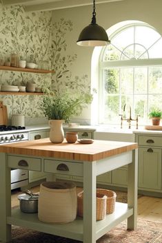 a kitchen with an island in the middle and shelves on the wall behind it,