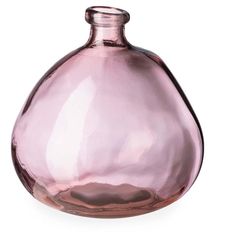 a pink glass vase sitting on top of a white table