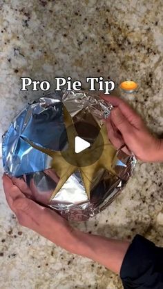 a person holding an aluminum foil star in their hand with the words pro pie tip on it