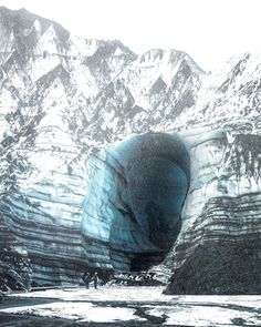 an ice cave in the mountains with snow on it