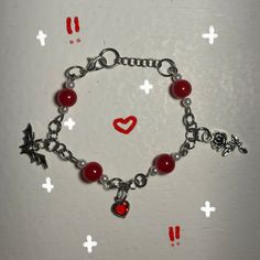 Handmade bracelet, with heart, bat and rose charms, with red and pink beads. With stainless steel materials. Long 19 cm. If you want a custom size, please buy the product and tell me the size in customization, I will send you updates on the process in DM. Red Metal Chain Bracelet Gift, Red Metal Chain Bracelet For Gift, Valentine's Day Beaded Bracelets With Charms As Gift, Valentine's Day Gift Beaded Bracelets With Charms, Valentine's Day Gift Beaded Bracelet With Charms, Red Heart Bracelets For Party, Heart Beads Dangle Bracelet Gift, Red Heart-shaped Metal Bracelets, Heart-shaped Red Bracelets For Party