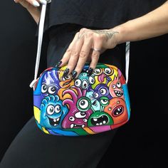 Cute Colorful little Monsters Graffiti Bag The Original Hand painted Bag  The cute small crossbody bag will be great accessory for your outfit.  Complete your style with unique piece of art.  * Original Handpainted Bag * Genuine Leather  * Painting done with Acrylic paints covered with leather varnish * Size: 4"x 6"inch (15*20 cm) * Ready to ship * Express shipping 1-3 days worldwide * FREE DELIVERY * ONE OF A KIND The bag will be carefully packaged for long destination ship. I will do everythin Cartoon Style Multicolor Rectangular Bag, Multicolor Cartoon Style Bag For Everyday Use, Cartoon Style Multicolor Bags For Gifts, Cartoon Style Multicolor Bags As Gifts, Fun Crossbody Gift Bags, Playful Multicolor Crossbody Bag, Artistic Hand Painted Shoulder Bag For Gift, Artistic Hand Painted Shoulder Bag Gift, Fun Multicolor Shoulder Bag