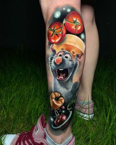 a person with a tattoo on their leg has a rat eating tomatoes and pretzels