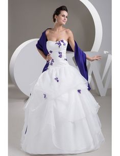 a woman in a white and purple wedding dress