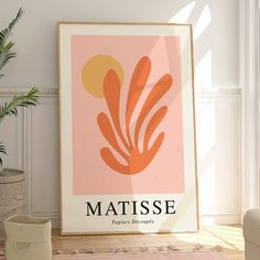 a poster with the name matissee on it next to a potted plant