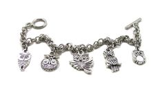 "Owl Bracelet Show off your love of Owls with this fun, unique piece of jewelry! Delicate bracelet, lovely to wear and wonderful to give. The charms and the bracelet are made from a zinc alloy metal which is both lead and nickel free. This is an awesome collection of charms for the owl lover in your life! PLEASE NOTE: From time to time we may need to substitute one of the charms for another, all keeping with the theme of the collection. Charm is zinc alloy, lead and nickel free. Each charms meas Adjustable Novelty Charms Bracelets, Novelty Charms Bracelet Jewelry, Novelty Jewelry Charms Bracelet, Novelty Bracelet Jewelry As Gift, Novelty Bracelet Jewelry For Gifts, Novelty Bracelet Jewelry Gift, Personalized Novelty Charm Bracelet, Adjustable Novelty Charm Bracelet, Adjustable Novelty Charm Bracelet With Lobster Clasp