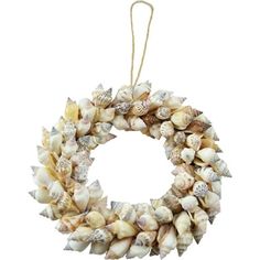 a wreath with seashells hanging from it