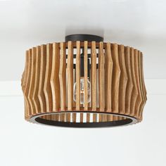 a wooden light fixture hanging from the ceiling