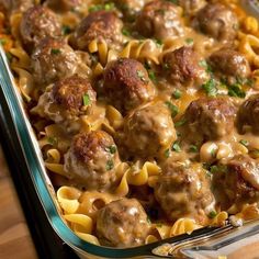 a casserole dish filled with meatballs and noodles