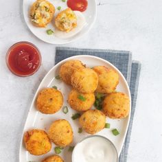 small appetizers on plates with dip and sauce