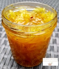 a jar filled with food sitting on top of a table