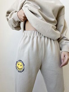 About -Relaxed -75% Polyester 25% Cotton -Lining 100% Polyester -Hand Wash or Dry Clean -Elastic Waistband -Fitted Ankles That 90's style is not lost on these sweatpants. They feature an elastic waistband and fitted ankles. These causal sweatpants are too cute, the smile logo adds a fun touch to a casual basic. Pair these with a cropped black tee and throw on a jean jacket if its chilly and you are sure to stand out while you're out and about. You'll look cute and stylish while being super comfy Sweatpants Fit, Smile Logo, Style Sweatpants, Sweatpants With Pockets, Lounge Outfit, Matching Sweatshirts, The Smile, Rayon Pants, Fashion Joggers