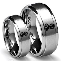 two wedding rings with horses engraved on them