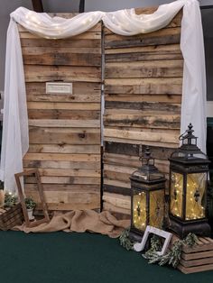 an image of a stage set made out of wood pallets and white drapes