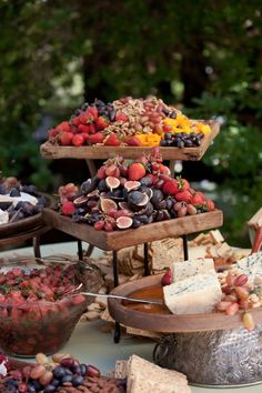 a table topped with lots of different types of foods and desserts on top of it