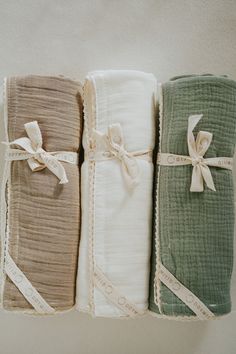 four folded towels tied together in different colors