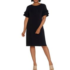 New In Online Package Bob Mackie Regular Knit Dress Black Only A310827 Fabrication: Knit Features: Short Ruffle Sleeves, Round Neckline, Princess Seaming, Center Back Seam Fit: Semi-Fitted At The Bust And Waist, Follows The Lines Of The Body With Added Wearing Ease; Flares To A Full Bottom Opening; Relaxed Sleeves Length 37.5" - 37.75" Armpit To Armpit Xxs 17.5" Xs 18.5" Content: 89% Polyester/11% Spandex Care: Machine Wash, Line Dry Dress Black Ruffle Sleeve Formal Dress, Black Formal Dress With Ruffle Sleeves, Ruffle Sleeve Stretch Dresses For Work, Stretch Ruffle Sleeve Dresses For Work, Black Fitted Midi Dress With Ruffle Sleeves, Black Career Dresses For Spring, Black Career Dress With Short Sleeves, Black Short Sleeve Career Dress, Black Ruffled Sheath Dress