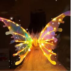 a lighted butterfly sitting on top of a table