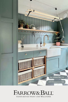 an image of a kitchen setting with blue cabinets and white counter tops, including baskets