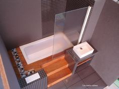 a bathroom with a sink, toilet and bathtub is shown in this aerial view