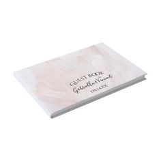 a white book with writing on the front and back cover that says guest notes, congratulations