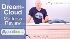 a man sitting on top of a bed with the words dream cloud mattress review written above it