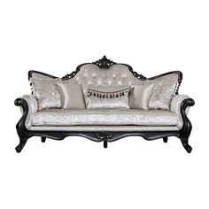 an old fashioned couch with pillows on the top and bottom, sitting against a white background