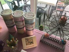 an assortment of confection items on a table in front of a ferris wheel