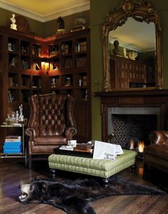 a living room filled with furniture and a fire place