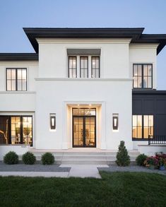 a white house with black trim and windows