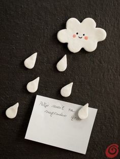 there is a paper with some raindrops on it and a note attached to it