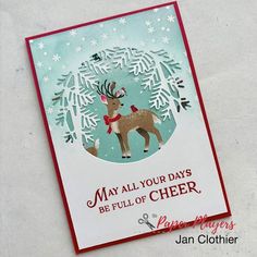 a handmade christmas card with a reindeer and snowflakes on the background that says, may all your days be full of cheer