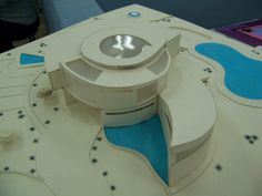 a model of a building with a pool in the center and stars on the outside